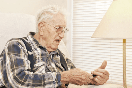 Elderly Man with cell Phone- Help prevent your senior from falling for a phone scam