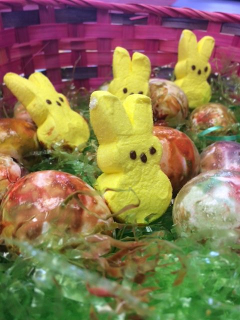 Eggs look cute with the peeps in the basket