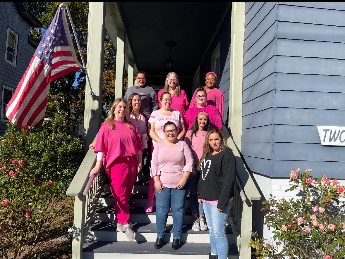 Group photo of Care at Home staff, outside the office at 240 Williams street in New london CT