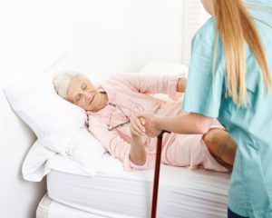 Caregiver helping with post-surgical care