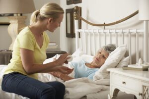 caregiver assisting elderly woman